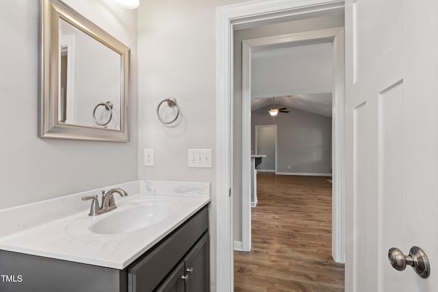24 Windchime Ct, Clayton, NC 27527 - bathroom with vanity, vaulted ceiling, wood finished floors, and ceiling fan