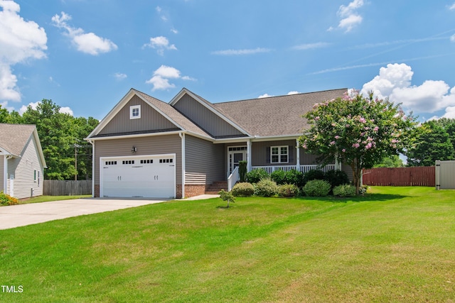 24 Windchime Ct, Clayton, NC 27527 - craftsman-style house with an attached garage, driveway, covered porch, and brick siding
