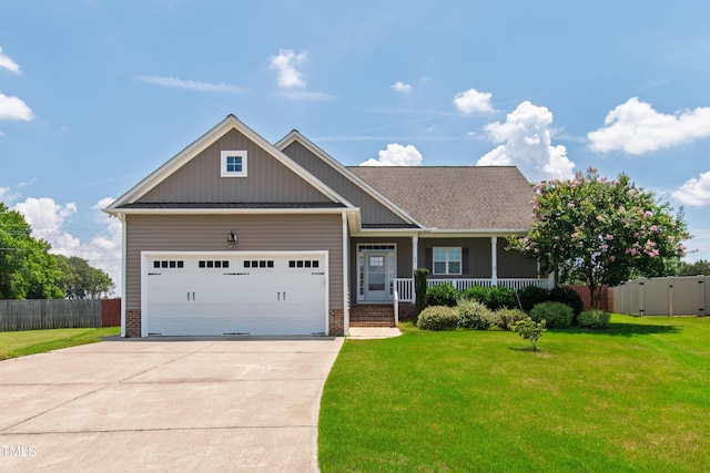 24 Windchime Ct, Clayton, NC 27527 - craftsman-style house with a porch, an attached garage, driveway, and brick siding