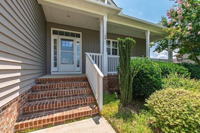 24 Windchime Ct, Clayton, NC 27527 - doorway to property with a porch