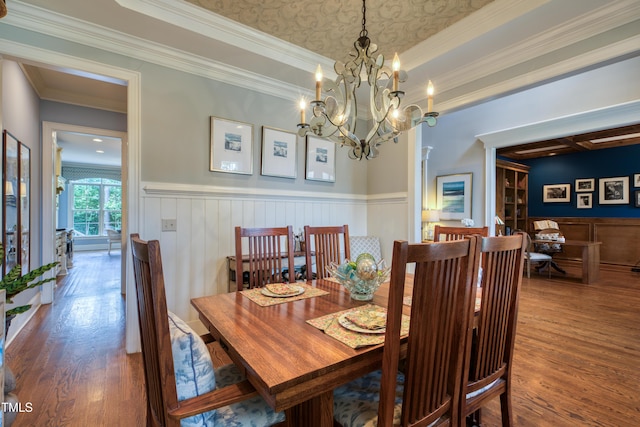 633 Rolling Springs Dr, Cary, NC 27519 - dining space featuring wood finished floors, ornamental molding, wainscoting, and a chandelier