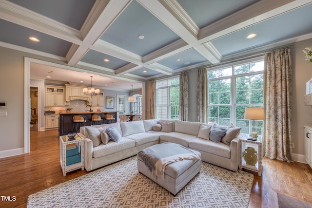 633 Rolling Springs Dr, Cary, NC 27519 - living room featuring a chandelier, crown molding, coffered ceiling, wood finished floors, and beamed ceiling
