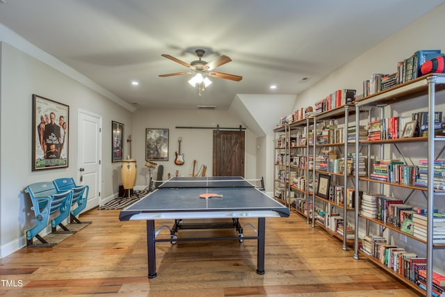 633 Rolling Springs Dr, Cary, NC 27519 - recreation room with a barn door, ceiling fan, wood finished floors, and recessed lighting