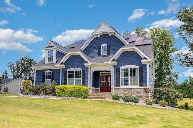 119 Florentino Ct, Clayton, NC 27527 - view of front of property with a front yard, french doors, solar panels, and a shingled roof