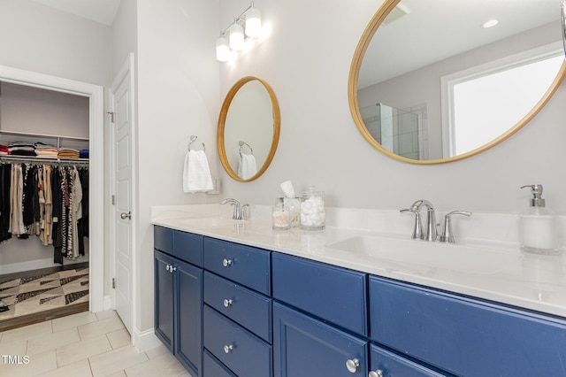 119 Florentino Ct, Clayton, NC 27527 - full bath featuring double vanity, tile patterned floors, and a walk in closet