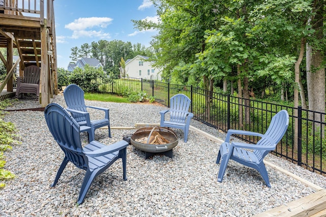 119 Florentino Ct, Clayton, NC 27527 - fenced backyard featuring an outdoor fire pit