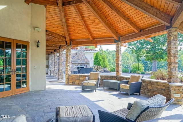 119 Florentino Ct, Clayton, NC 27527 - view of patio / terrace with french doors and an outdoor living space with a fireplace