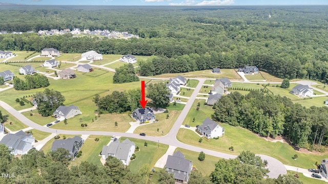 119 Florentino Ct, Clayton, NC 27527 - aerial view of property and surrounding area featuring a forest and nearby suburban area