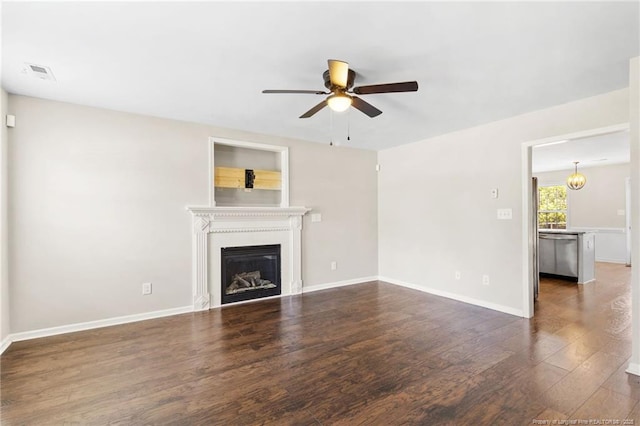 428 Basket Oak Dr, Bunnlevel, NC 28323 - unfurnished living room with a ceiling fan, wood finished floors, and a glass covered fireplace