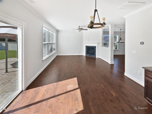 1092 Adams Point Dr, Garner, NC 27529 - unfurnished living room featuring ornamental molding, a ceiling fan, dark wood finished floors, and a fireplace