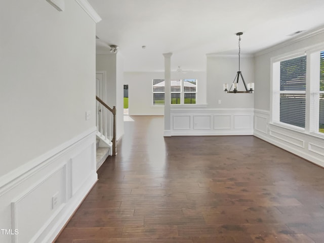 1092 Adams Point Dr, Garner, NC 27529 - unfurnished dining area featuring ornamental molding, a decorative wall, plenty of natural light, stairway, and a chandelier