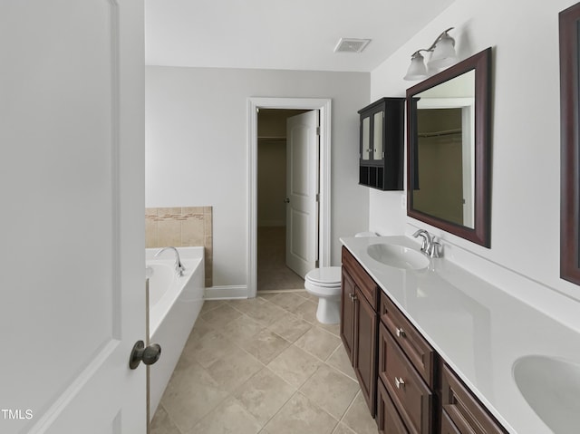 1092 Adams Point Dr, Garner, NC 27529 - full bath featuring double vanity, a garden tub, tile patterned flooring, and a spacious closet