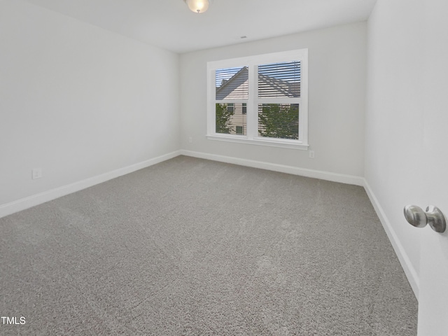 1092 Adams Point Dr, Garner, NC 27529 - carpeted empty room with baseboards