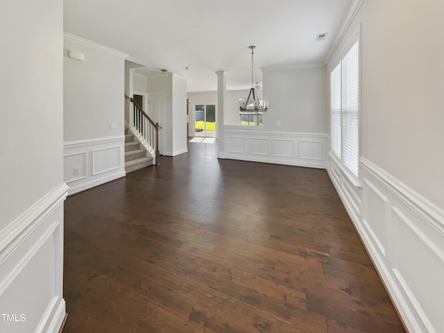 1092 Adams Point Dr, Garner, NC 27529 - unfurnished dining area featuring a decorative wall, a chandelier, plenty of natural light, stairway, and dark wood-style floors
