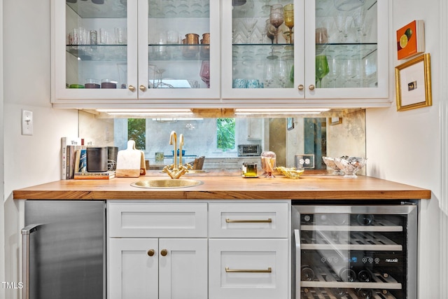 227 W Drewry Ln, Raleigh, NC 27609 - indoor wet bar featuring wine cooler and stainless steel refrigerator