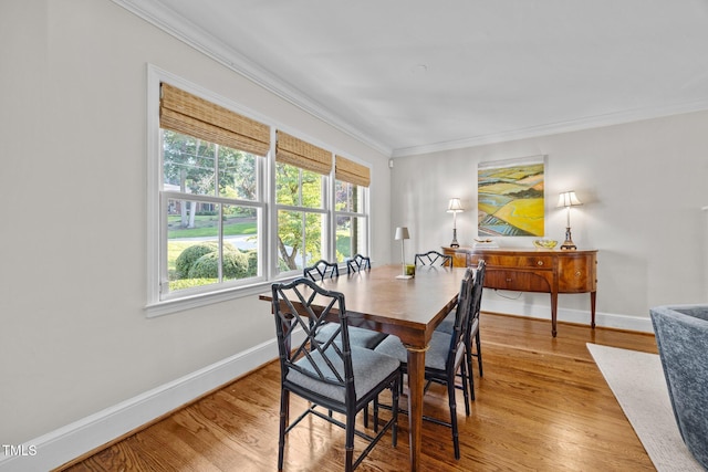 227 W Drewry Ln, Raleigh, NC 27609 - dining space featuring crown molding and light wood-style floors