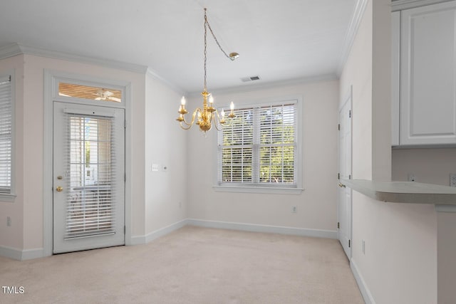 108-203 Northbrook Dr Unit 203, Raleigh, NC 27609 - unfurnished dining area with ornamental molding, a chandelier, and light colored carpet