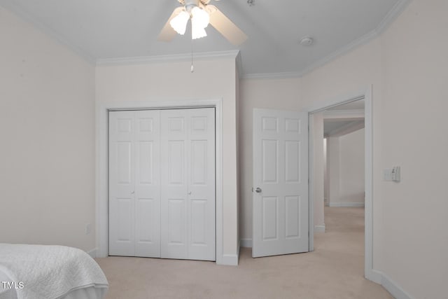108-203 Northbrook Dr Unit 203, Raleigh, NC 27609 - bedroom featuring light carpet, crown molding, a closet, and ceiling fan