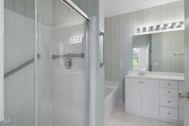 108-203 Northbrook Dr Unit 203, Raleigh, NC 27609 - bathroom with a stall shower, vanity, a garden tub, tile patterned floors, and wallpapered walls