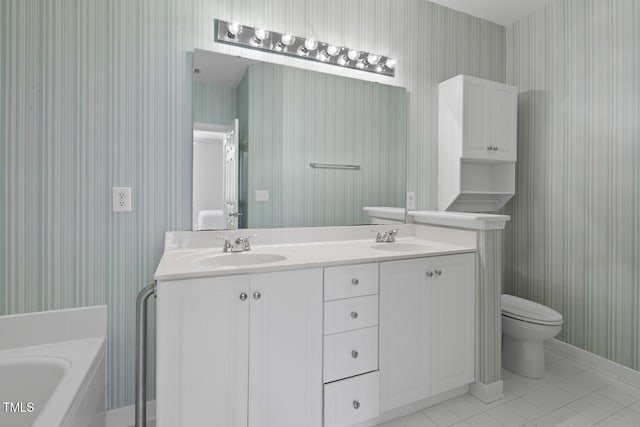 108-203 Northbrook Dr Unit 203, Raleigh, NC 27609 - full bath featuring wallpapered walls, double vanity, a garden tub, and tile patterned floors