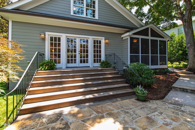 2707 Anderson Dr, Raleigh, NC 27608 - back of property with french doors, a sunroom, and stairs