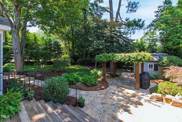 2707 Anderson Dr, Raleigh, NC 27608 - view of yard featuring a storage shed and a patio