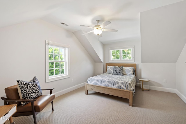 2707 Anderson Dr, Raleigh, NC 27608 - bedroom featuring lofted ceiling, multiple windows, light carpet, and a ceiling fan