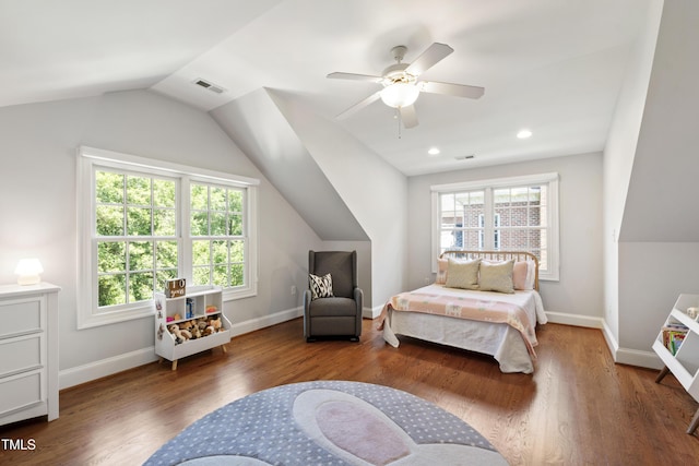 2707 Anderson Dr, Raleigh, NC 27608 - bedroom with multiple windows, vaulted ceiling, wood finished floors, and ceiling fan