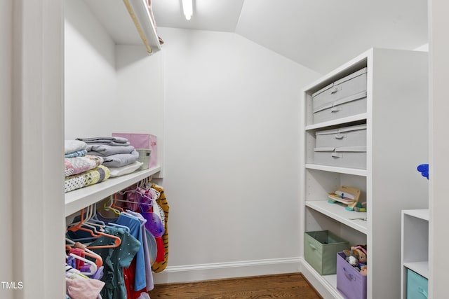 2707 Anderson Dr, Raleigh, NC 27608 - walk in closet featuring vaulted ceiling and wood finished floors