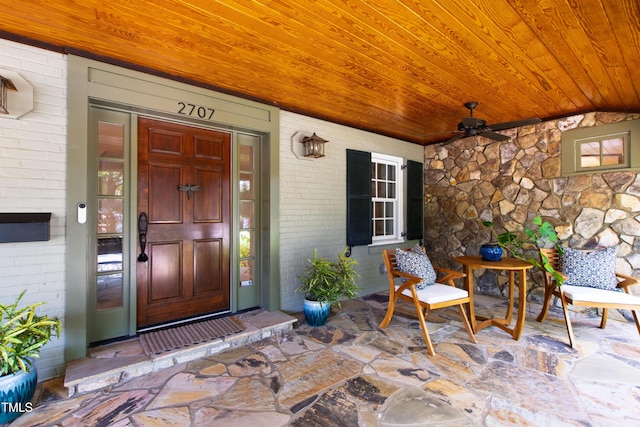 2707 Anderson Dr, Raleigh, NC 27608 - property entrance featuring brick siding and a ceiling fan
