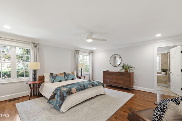 2707 Anderson Dr, Raleigh, NC 27608 - bedroom featuring crown molding, wood finished floors, connected bathroom, a ceiling fan, and recessed lighting