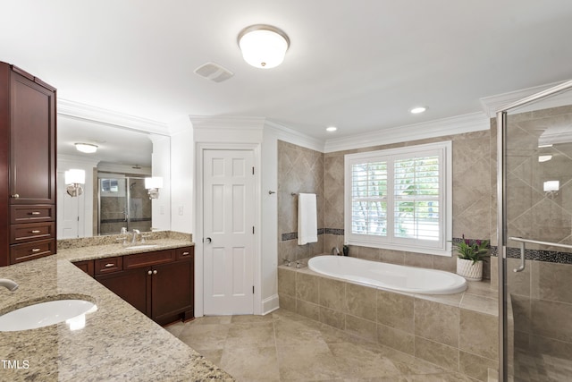 2707 Anderson Dr, Raleigh, NC 27608 - bathroom with vanity, a stall shower, a garden tub, ornamental molding, and tile patterned flooring