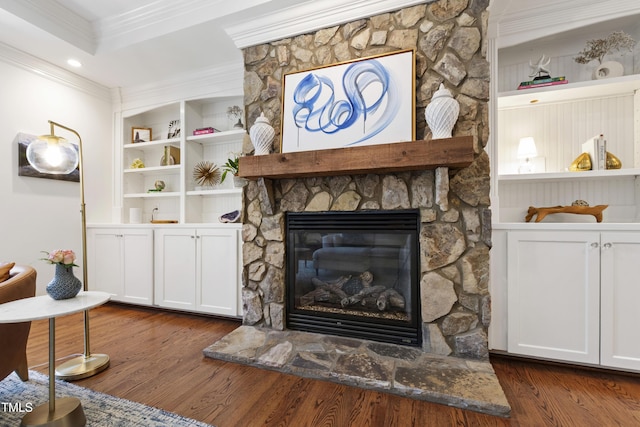 2707 Anderson Dr, Raleigh, NC 27608 - living area with ornamental molding, a fireplace, dark wood-style flooring, and built in features