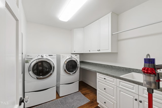 2707 Anderson Dr, Raleigh, NC 27608 - laundry area featuring cabinet space, washer and clothes dryer, and dark wood-style floors