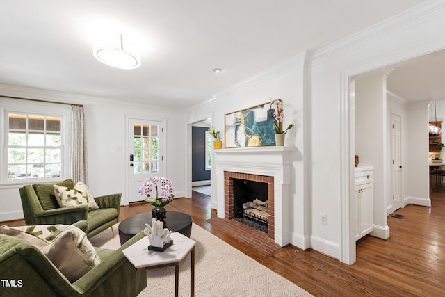 2707 Anderson Dr, Raleigh, NC 27608 - living area with wood finished floors, a fireplace, and ornamental molding