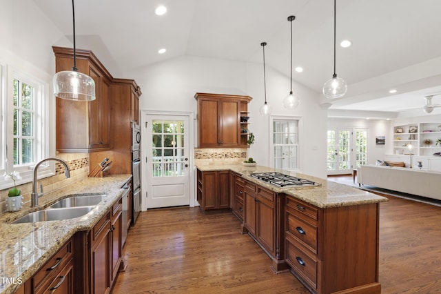2707 Anderson Dr, Raleigh, NC 27608 - kitchen featuring appliances with stainless steel finishes, a peninsula, open floor plan, open shelves, and light stone counters