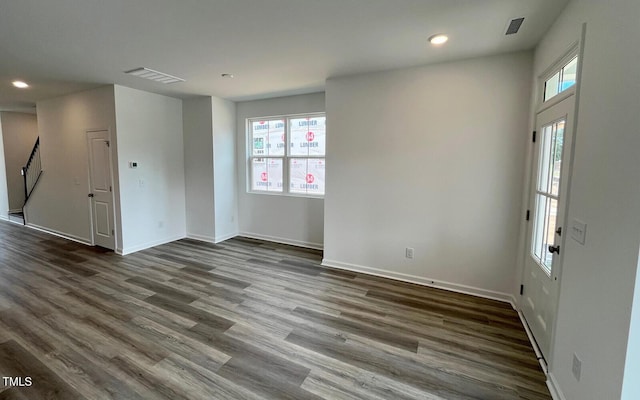 1559 Wendell Valley Blvd, Wendell, NC 27591 - spare room with dark wood-style flooring, recessed lighting, and stairway
