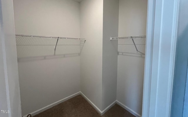 1559 Wendell Valley Blvd, Wendell, NC 27591 - walk in closet featuring dark carpet