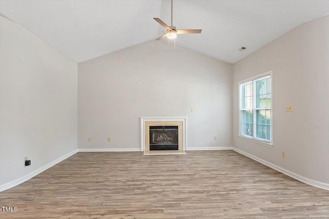 108 Ellsworth Pl, Cary, NC 27511 - unfurnished living room with ceiling fan, wood finished floors, a fireplace, and lofted ceiling
