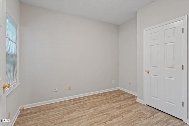 108 Ellsworth Pl, Cary, NC 27511 - spare room with light wood-style flooring and baseboards