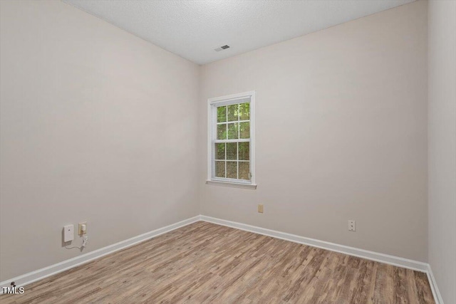 108 Ellsworth Pl, Cary, NC 27511 - unfurnished room with light wood-type flooring and baseboards