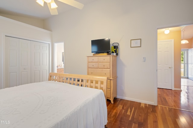 1401 Burchcrest Dr, Garner, NC 27529 - bedroom featuring vaulted ceiling, wood finished floors, a closet, a ceiling fan, and ensuite bathroom