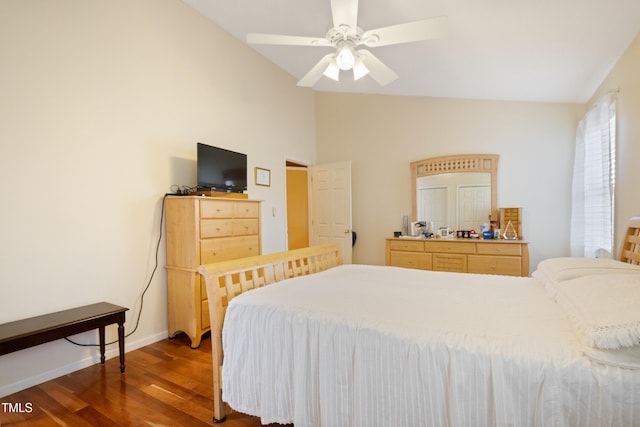 1401 Burchcrest Dr, Garner, NC 27529 - bedroom with dark wood-style floors, vaulted ceiling, and a ceiling fan