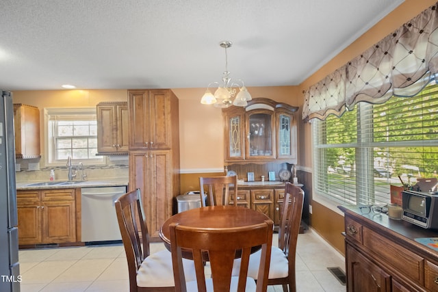 1401 Burchcrest Dr, Garner, NC 27529 - dining space featuring a chandelier and light tile patterned flooring