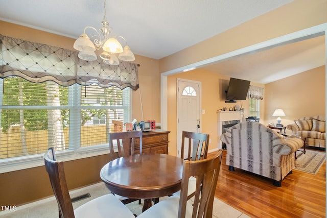 1401 Burchcrest Dr, Garner, NC 27529 - dining space featuring a chandelier and light wood finished floors