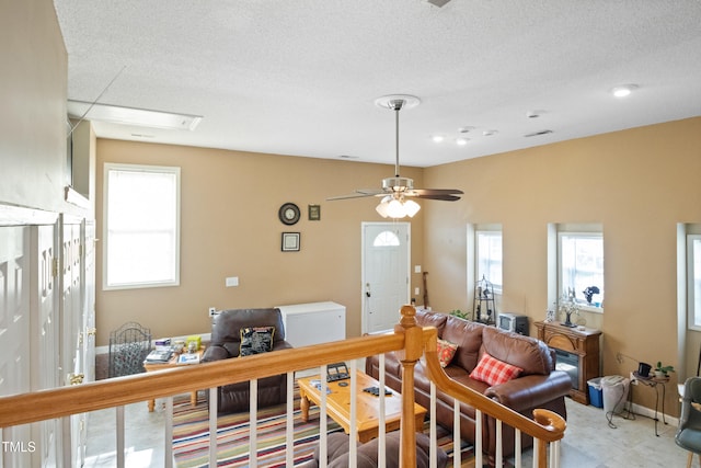 1401 Burchcrest Dr, Garner, NC 27529 - living area featuring plenty of natural light, a textured ceiling, and ceiling fan