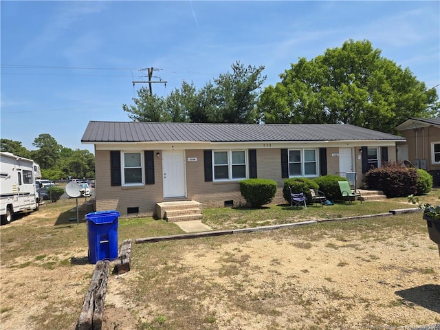 703 Lake Ave, Spring Lake, NC 28390 - ranch-style house with crawl space, a metal roof, and brick siding