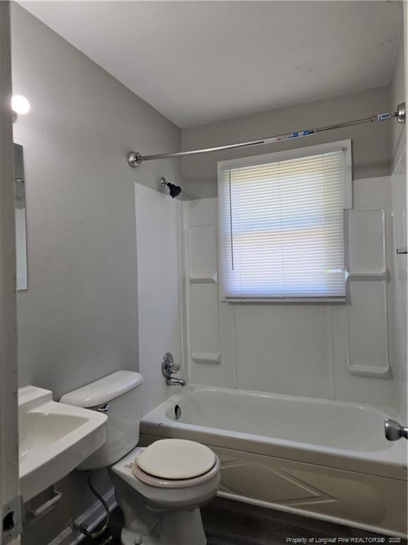 703 Lake Ave, Spring Lake, NC 28390 - full bath with bathtub / shower combination and wood finished floors