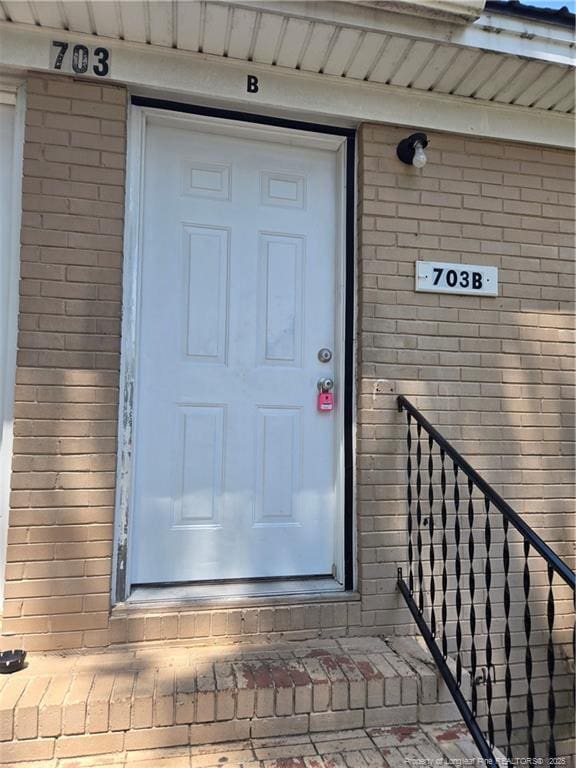 703 Lake Ave, Spring Lake, NC 28390 - doorway to property featuring brick siding