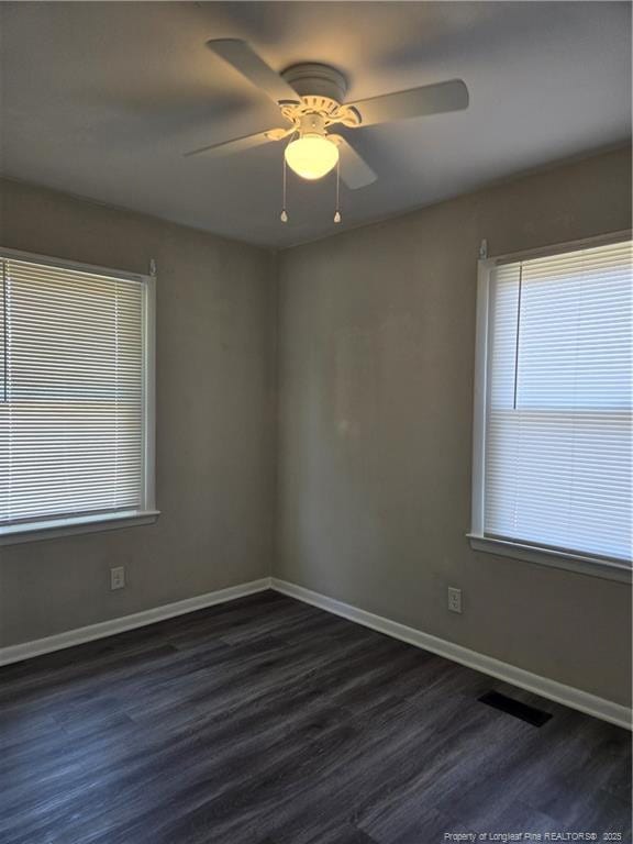 703 Lake Ave, Spring Lake, NC 28390 - unfurnished room with dark wood finished floors and ceiling fan